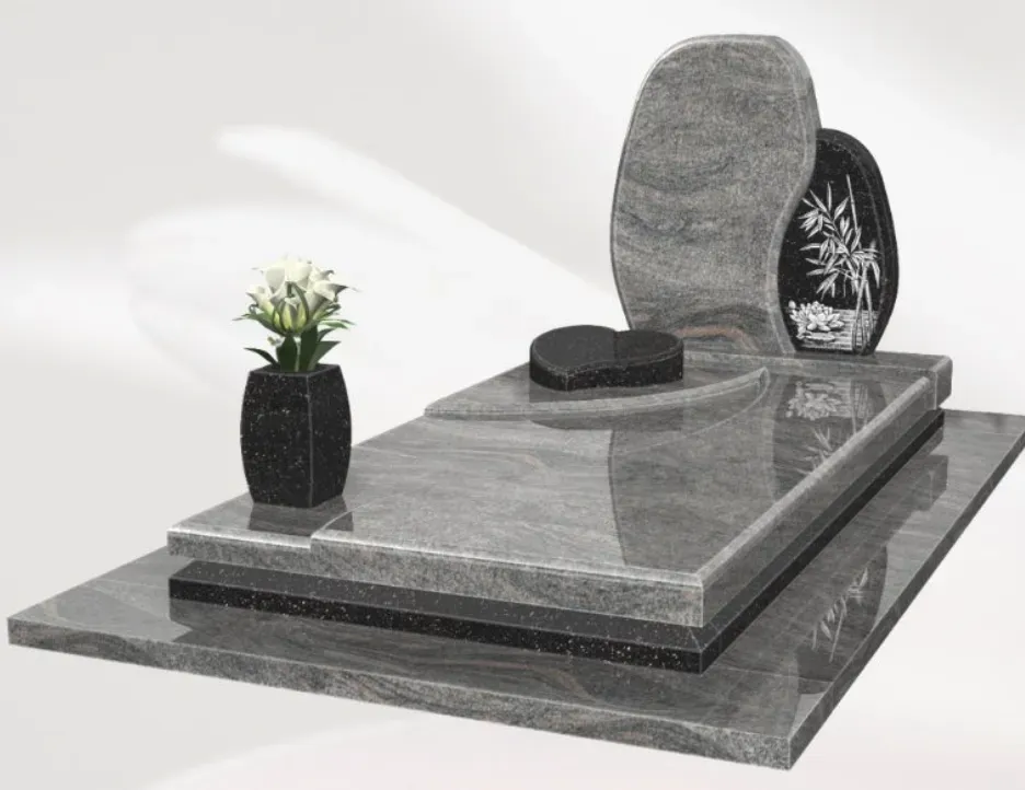 Monument funéraire moderne en granit gris orné de bambous.